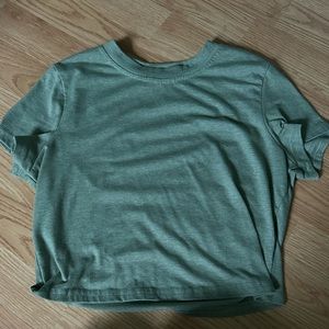 green cropped top